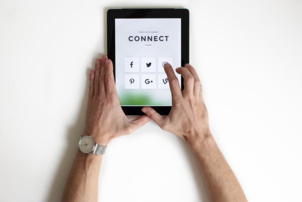 Picture of man using a tablet to connect on social media