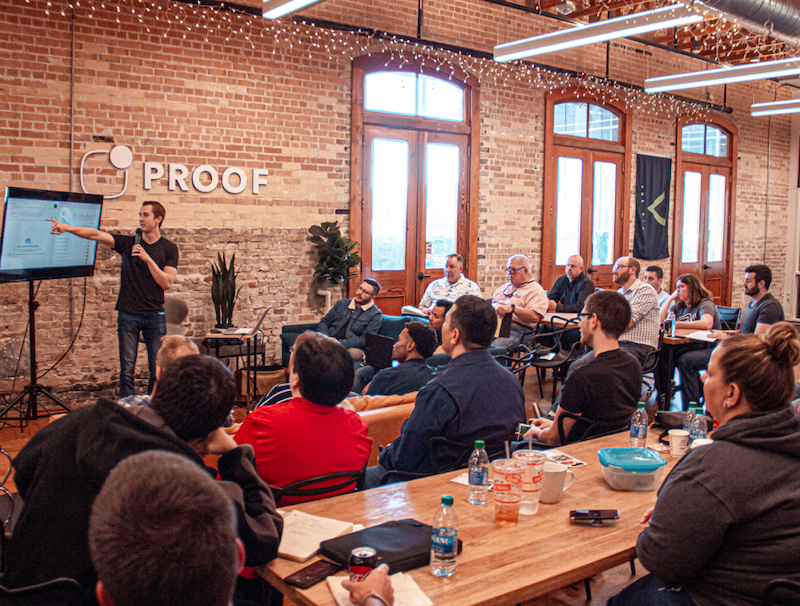 Picture of a man speaking in front of a group