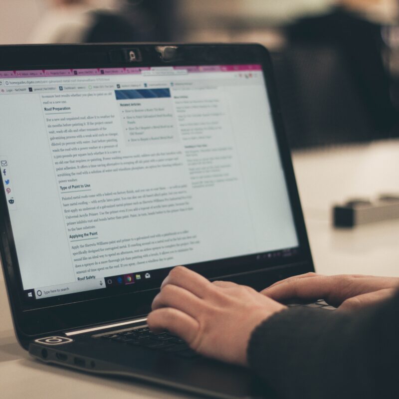 Image of someone typing on a laptop