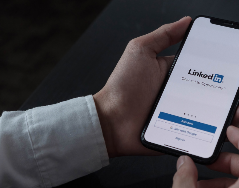 Image of man logging into LinkedIn on mobile device.